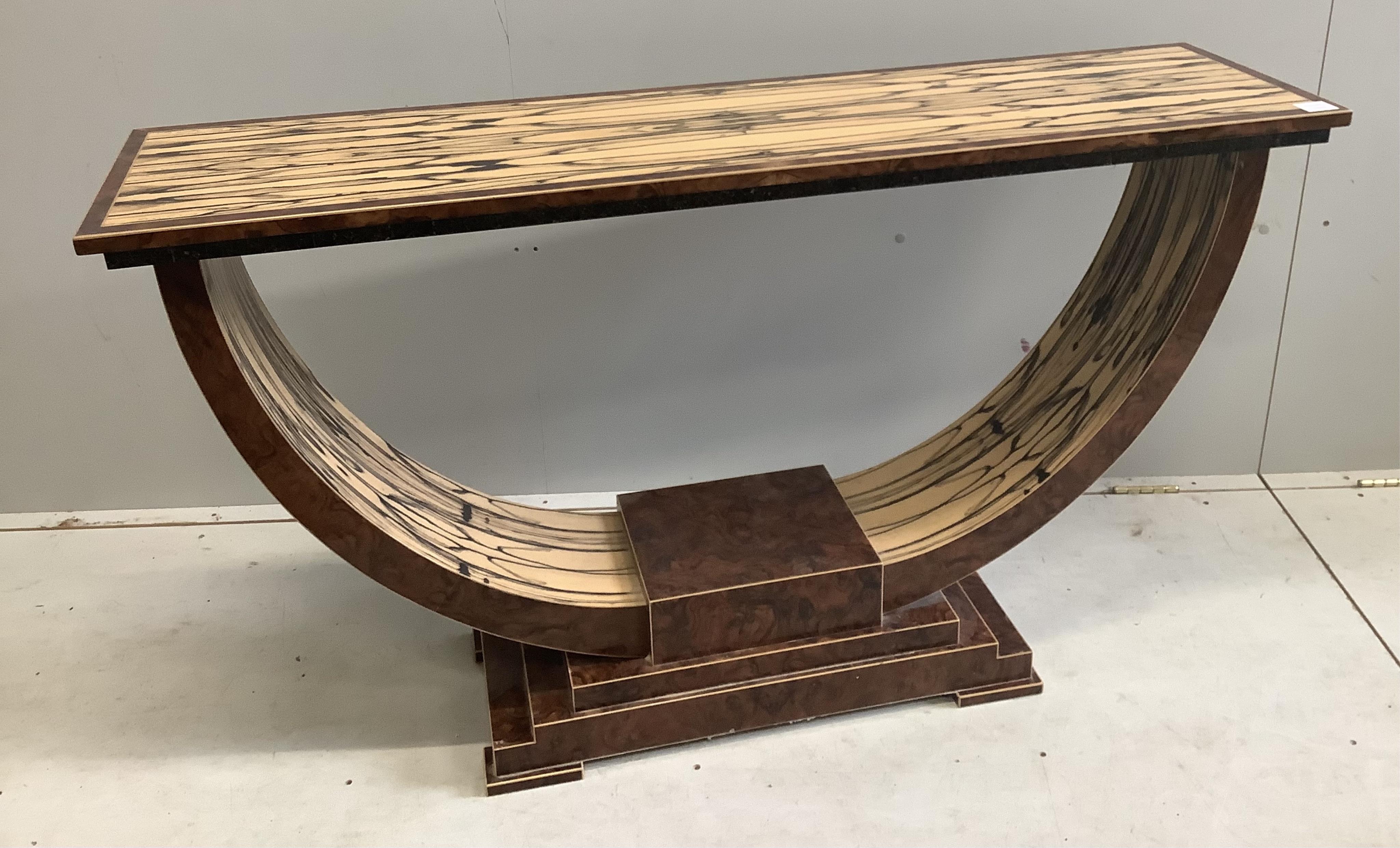 An Art Deco style white ebony and walnut console table